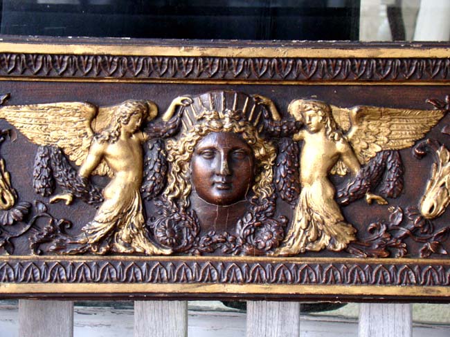 A carved pine panel with gilt highlights in the Italianate style circa 1800